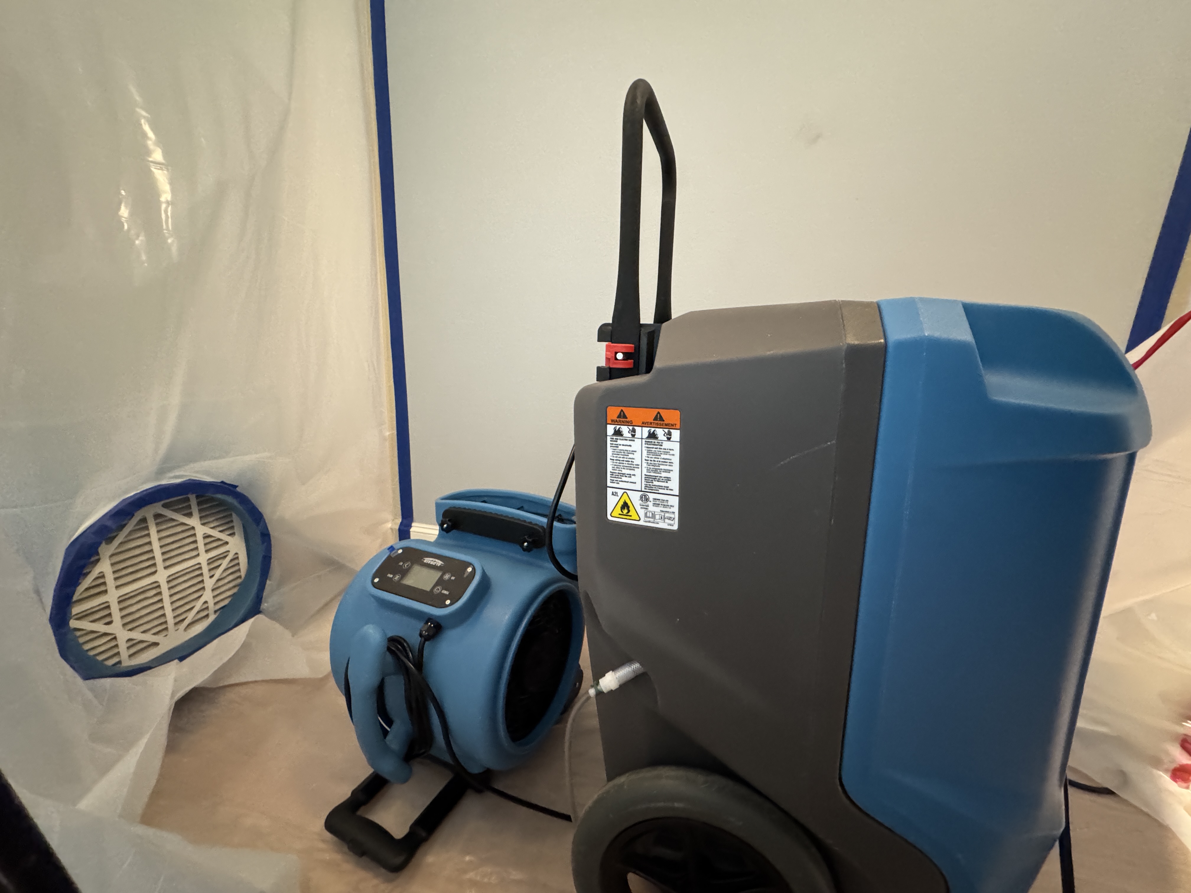 Professional restoration equipment including dehumidifier and air movers